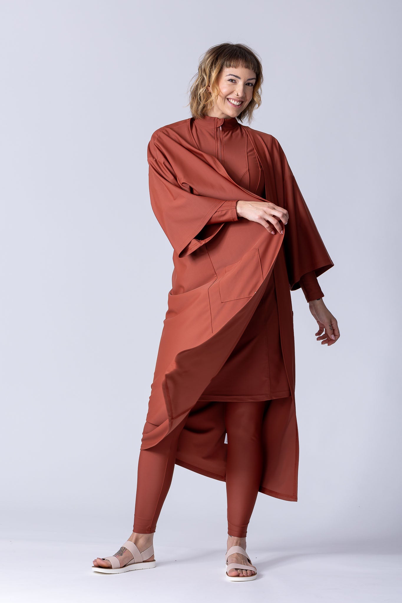 Beach Cover Up in terracotta colour maxi length with pocket, belt and made of swim fabric.