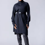 Long line tunic top in black. With front zipper, hidden side panels, back breathability panel and waist belt with buckle.