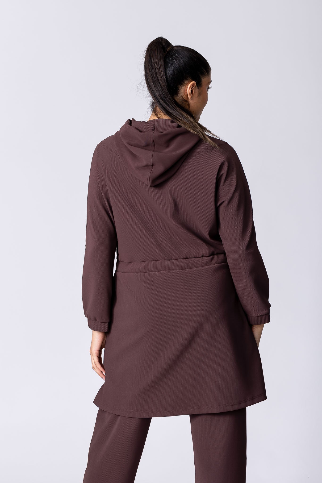 Coffee or brown colour longline hoodie with waist adjustability and draw string.
