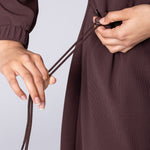 Coffee or brown colour longline hoodie with waist adjustability and draw string.