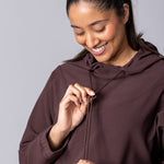 Coffee or brown colour longline hoodie with waist adjustability and draw string.