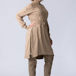Long line tunic top in beige. With front zipper, hidden side panels, back breathability panel and waist belt with buckle.