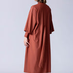 Beach Cover Up in terracotta colour maxi length with pocket, belt and made of swim fabric.