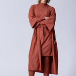 Beach Cover Up in terracotta colour maxi length with pocket, belt and made of swim fabric.