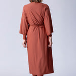 Beach Cover Up in terracotta colour maxi length with pocket, belt and made of swim fabric.