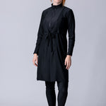 Modest midi swim tunic in black with front zipper, waist belt and UV proof swim fabric.
