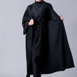 Beach Cover Up in black maxi length with pocket, belt and made of swim fabric.