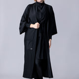 Beach Cover Up in black maxi length with pocket, belt and made of swim fabric.