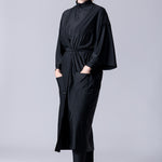 Beach Cover Up in black maxi length with pocket, belt and made of swim fabric.