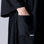 Beach Cover Up in black maxi length with pocket, belt and made of swim fabric.