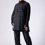 Light weight long line hoodie in black with adjustable waist, front pocket and large hood.