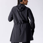 Light weight long line hoodie in black with adjustable waist, front pocket and large hood.