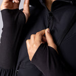 Light weight long line hoodie in black with adjustable waist, front pocket and large hood.