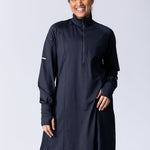 Long line tunic top in black. With front zipper, hidden side panels, back breathability panel and waist belt with buckle.