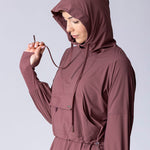 Light weight long line hoodie in dusty purple with adjustable waist, front pocket and large hood.