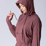 Light weight long line hoodie in dusty purple with adjustable waist, front pocket and large hood.
