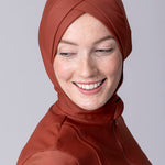 Instant swim hijab in terracotta colour from crisscross design for comfort and good fit. Has back clips to adjust sizing for lots of hair.