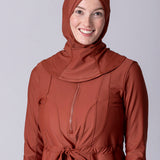 Instant swim hijab in terracotta colour from crisscross design for comfort and good fit. Has back clips to adjust sizing for lots of hair.